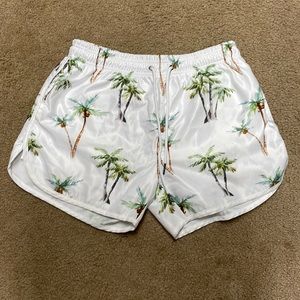 Women board shorts with palm trees. Medium